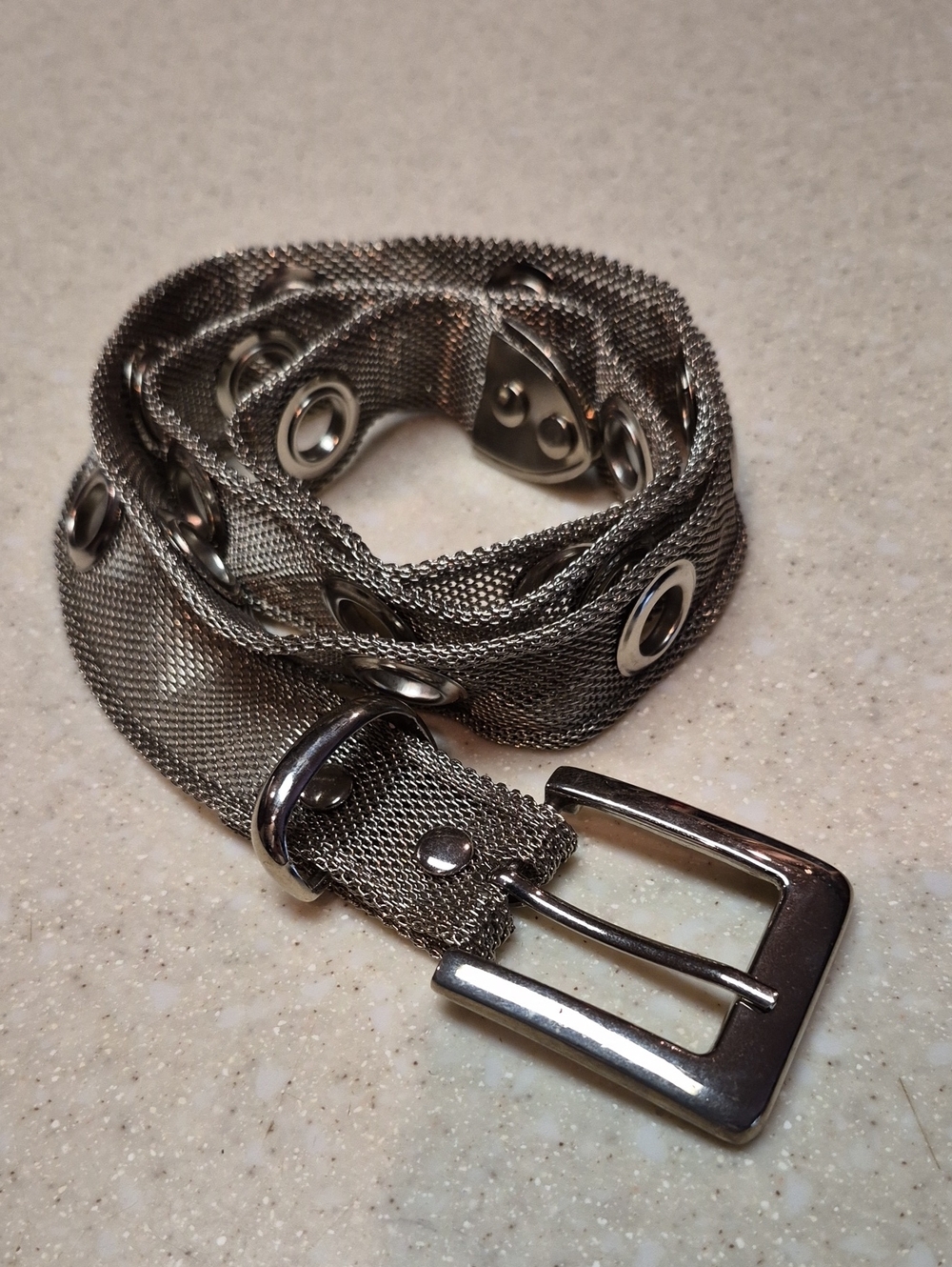 silver-toned metallic belt features a mesh chain construction - Picture 1 of 4